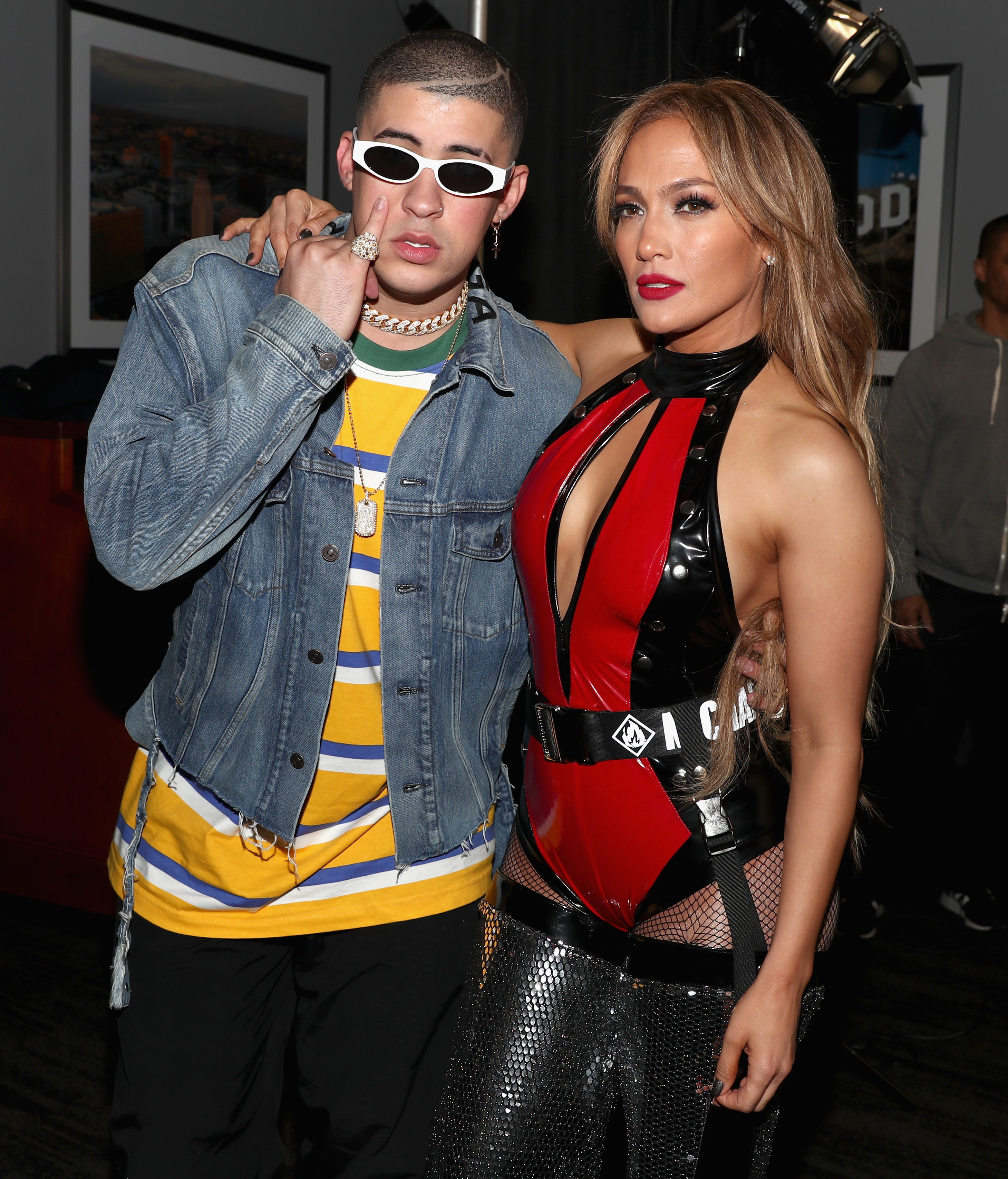 Bad Bunny and Jennifer Lopez with their arms around each other