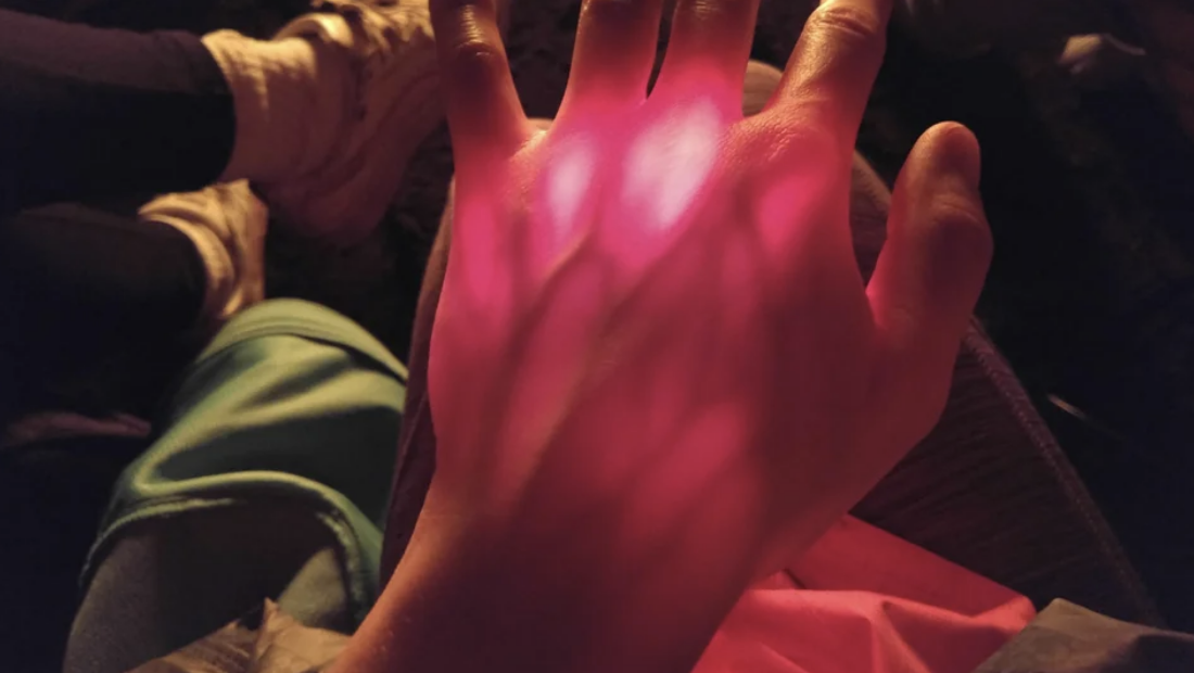 light coming through hand showing veins