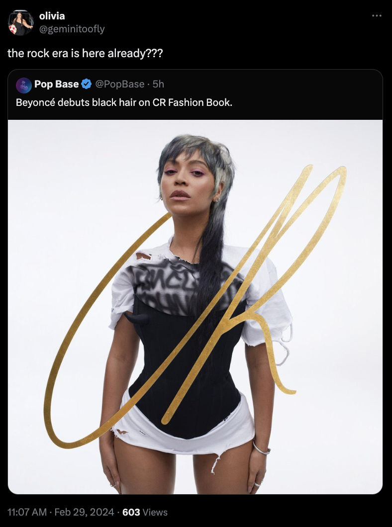 Beyoncé showcases black hair, wearing a graphic tee layered with a white top for CR Fashion Book