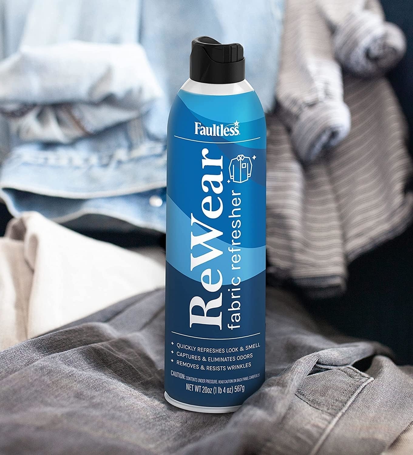 Faultless ReWear fabric refresher spray can positioned in front of casually folded garments