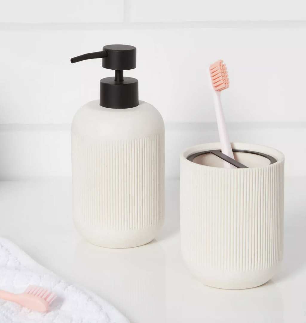 A sand-colored toothbrush holder