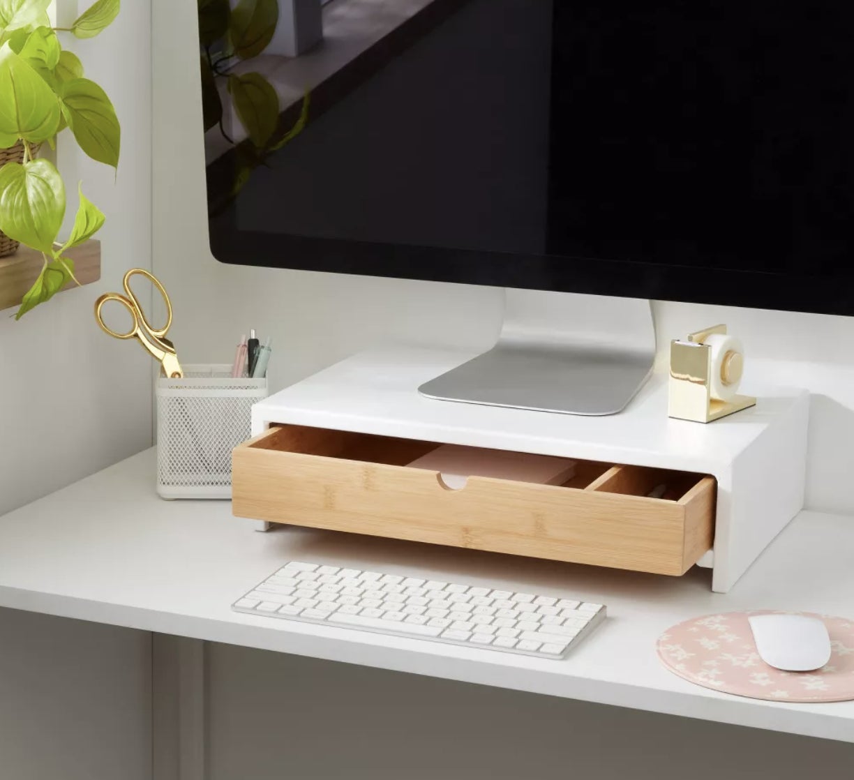 A monitor stand with a drawer