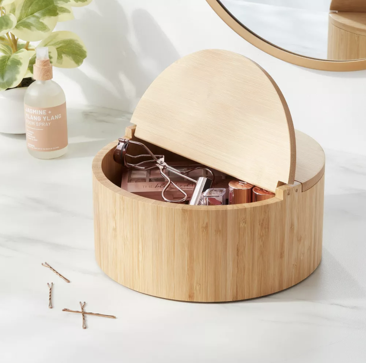 A bamboo countertop organizer with beauty products