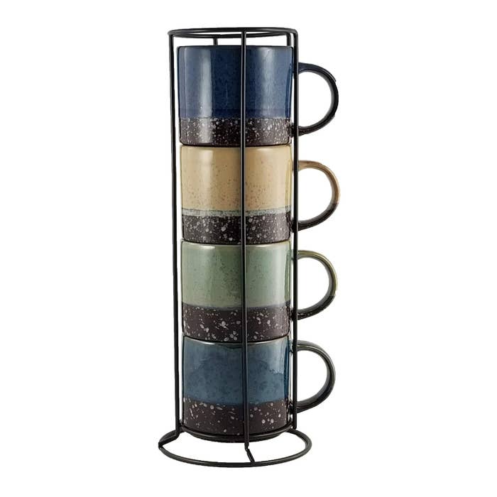 the four different colored mugs with granite bottoms stacked