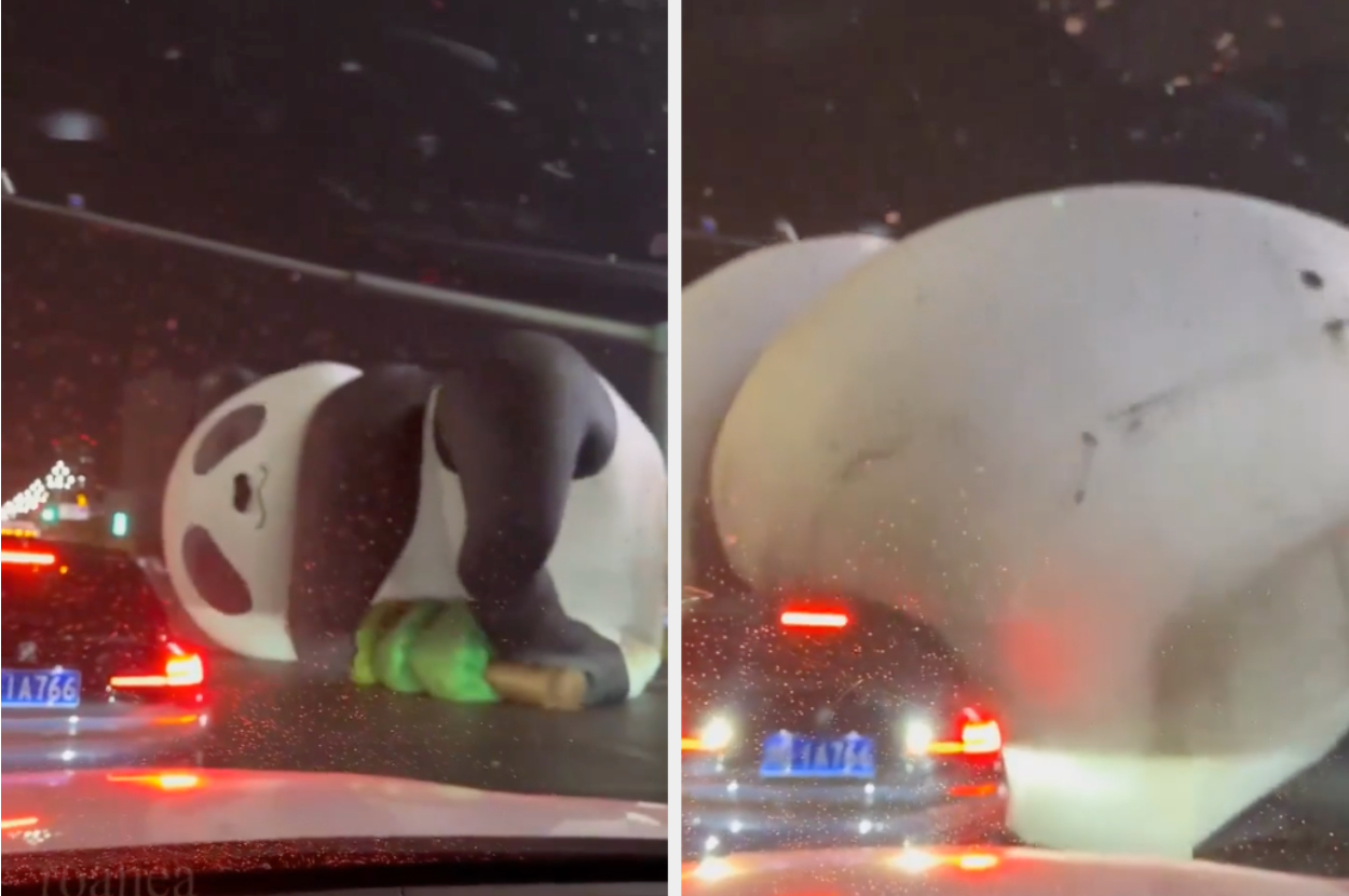 A panda on its side next to a police car on the road