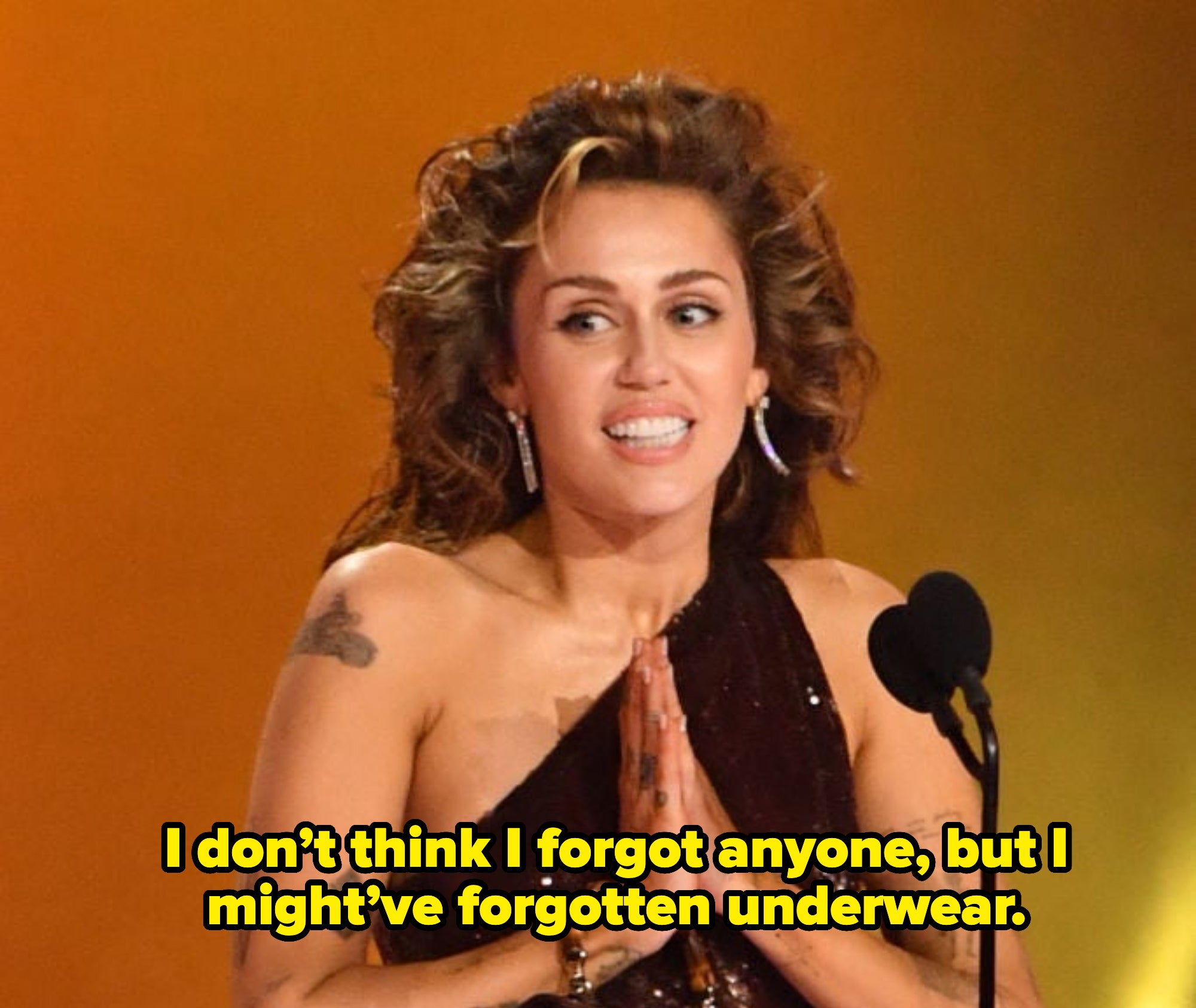 Miley onstage saying, &quot;I don&#x27;t think I forgot anyone, but I might&#x27;ve forgotten underwear&quot;