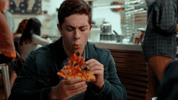 A man eating pizza