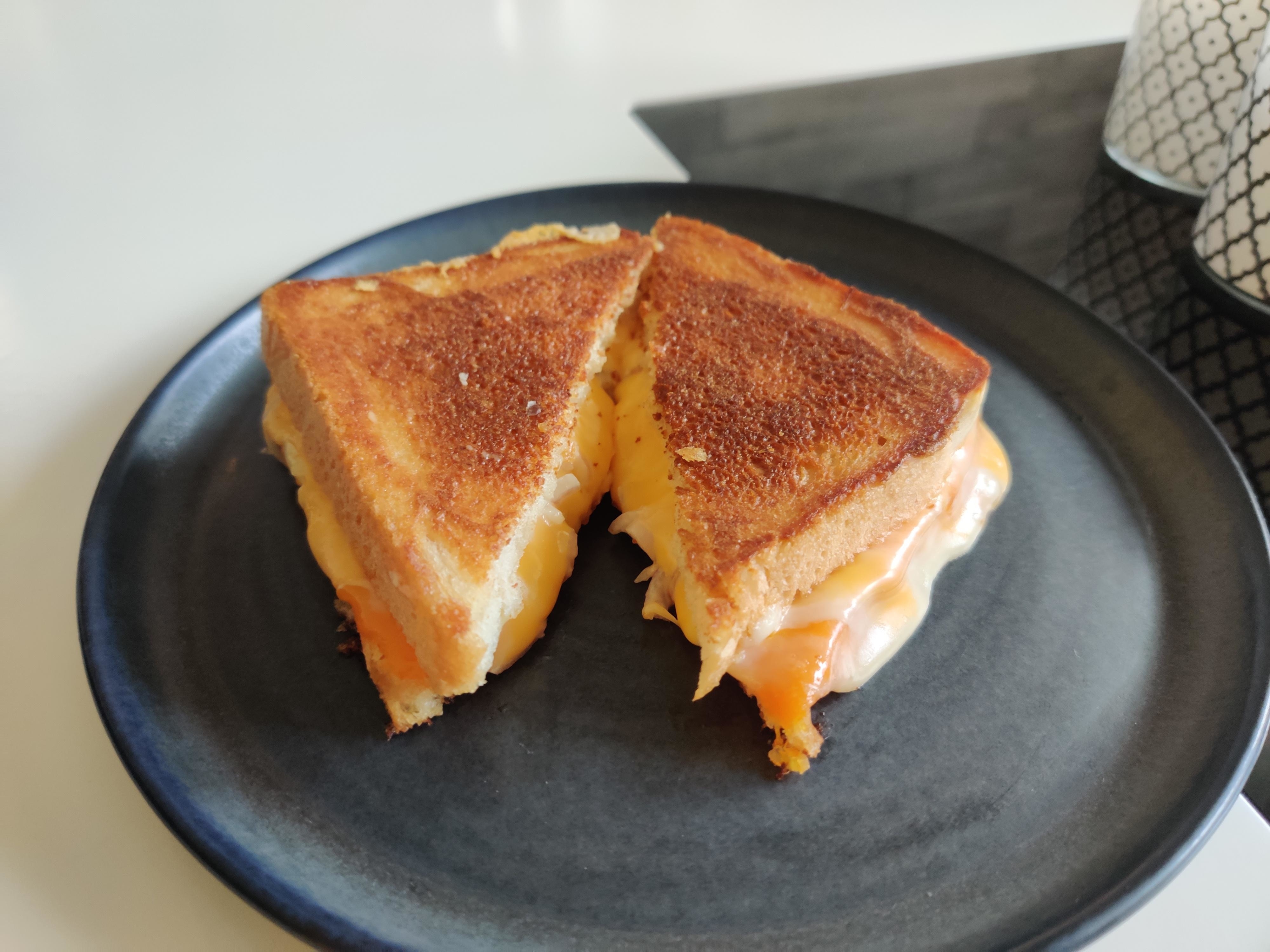 A grilled cheese sandwich on a plate