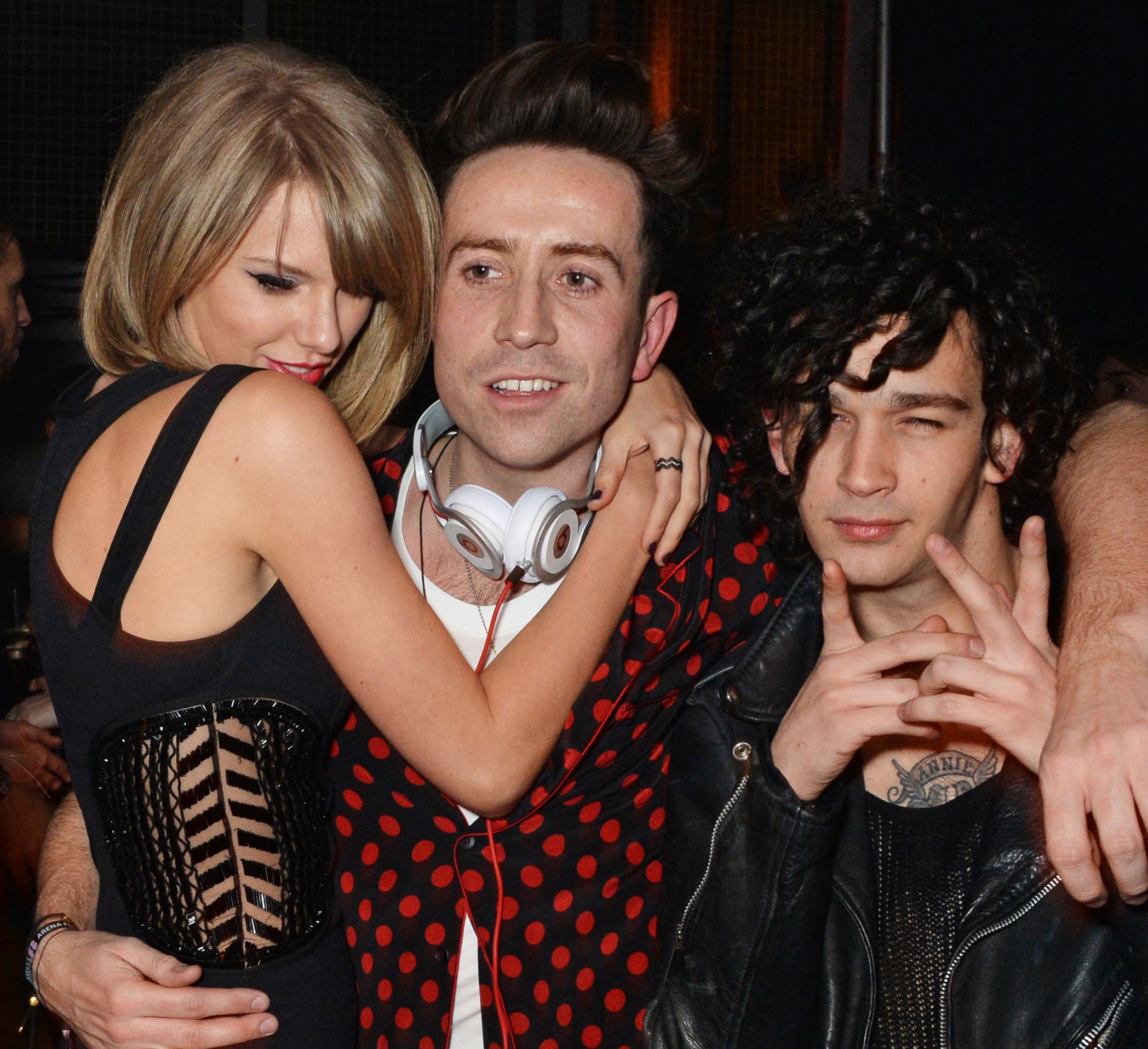 Taylor with Matty Healy and another gentleman