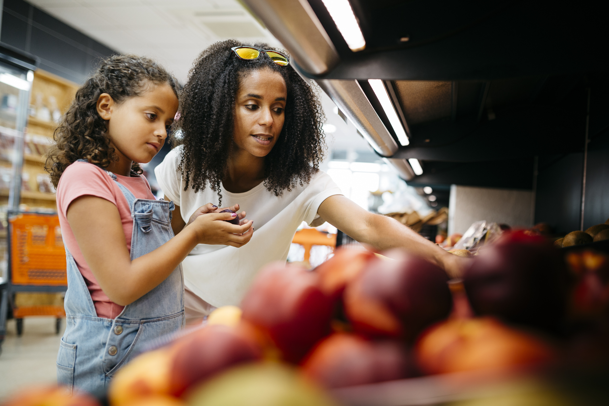 mom and daughter grocery shopping