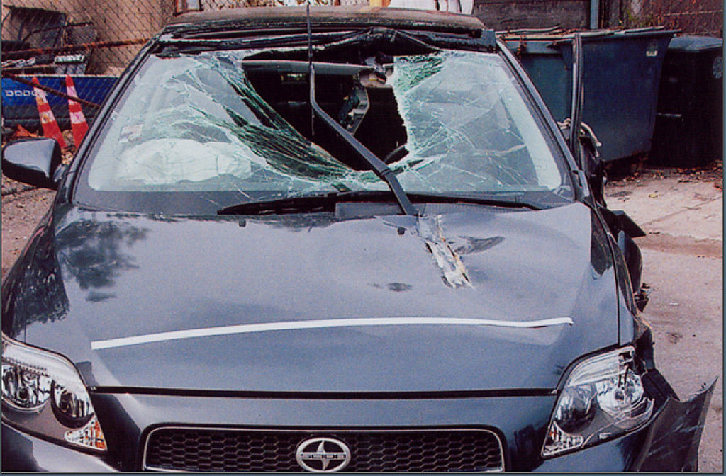 The vehicle driven by Gabriela Cedillo is shown with a damaged windshield and bent hood