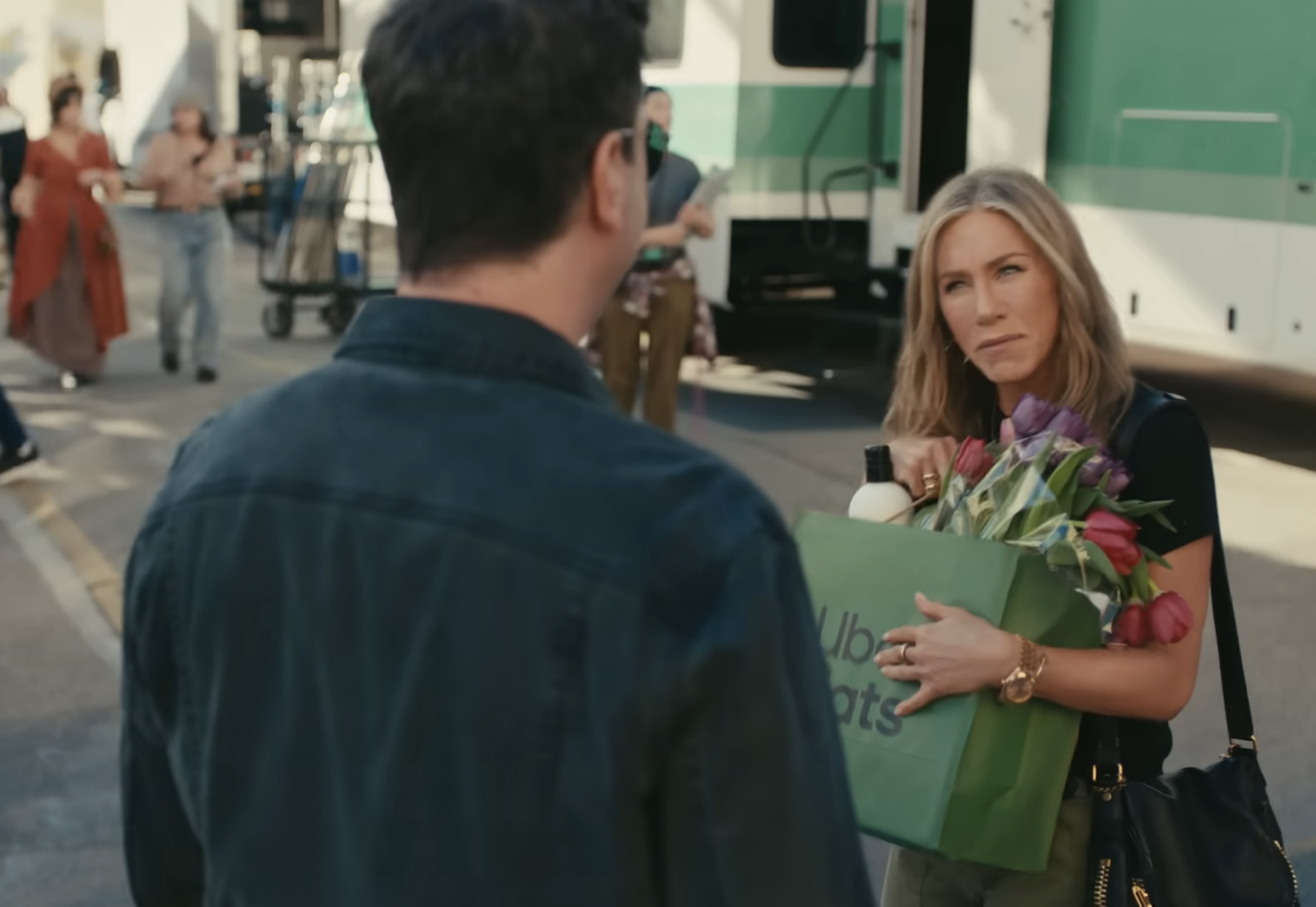 Jen looking at David in a scene from the Uber Eats commercial
