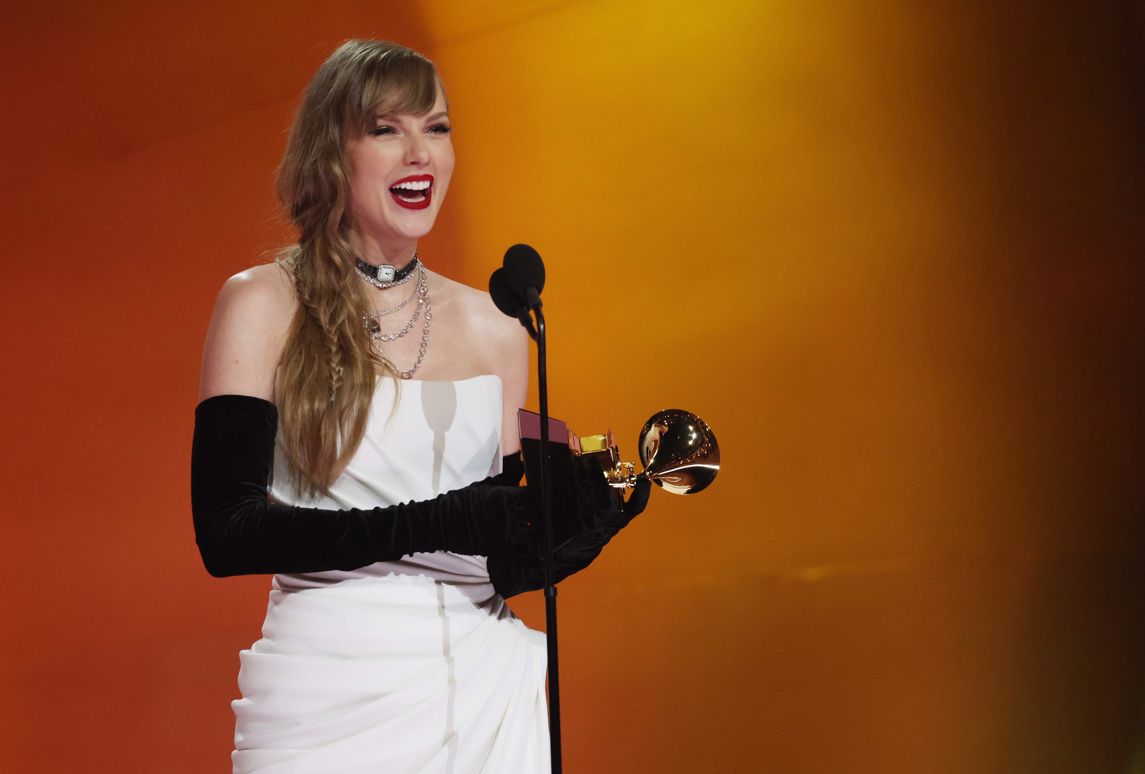 Taylor Swift accepting her Grammy award