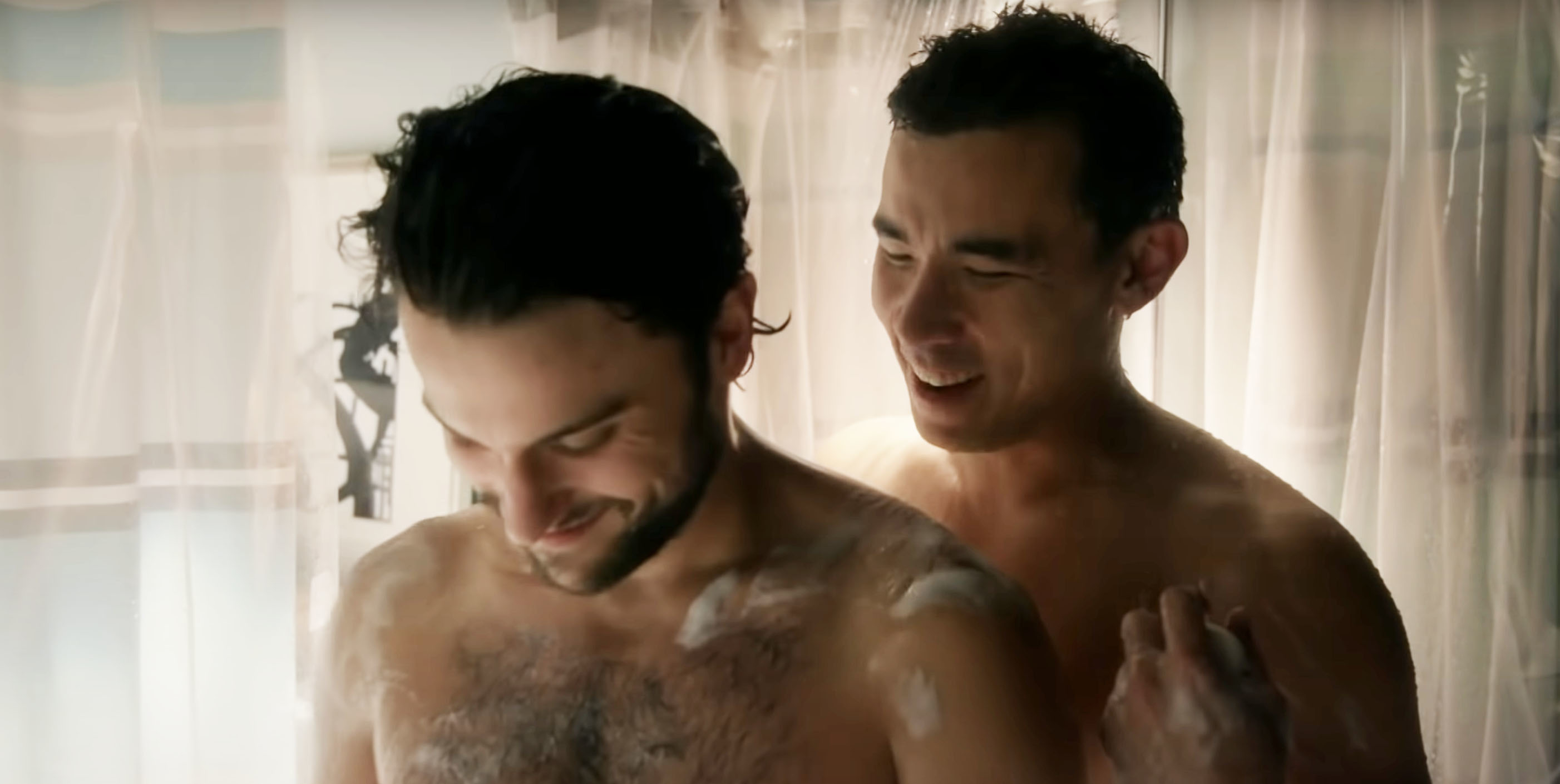 two men taking a shower together
