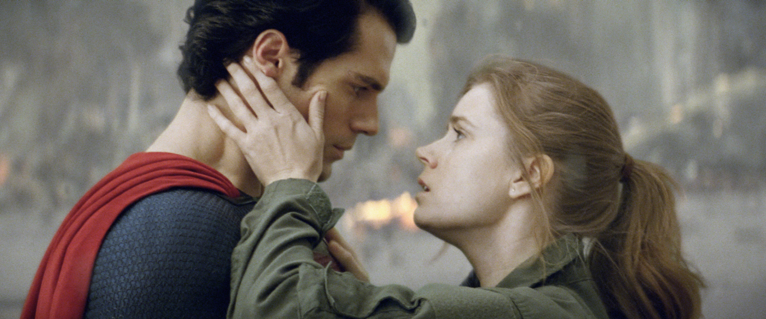 Henry as superman being embraced by Amy Adams as Lois Lane