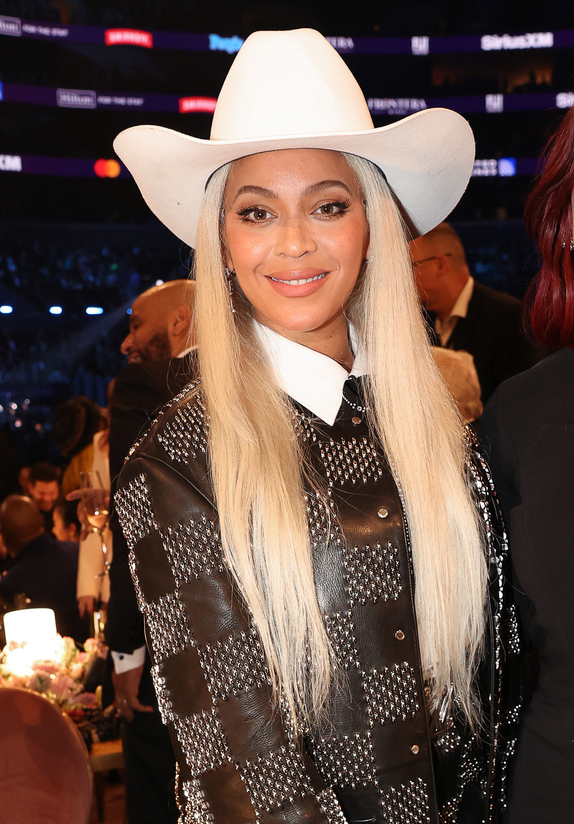 beyonce with platinum dyed hair wearing a cowboy hat