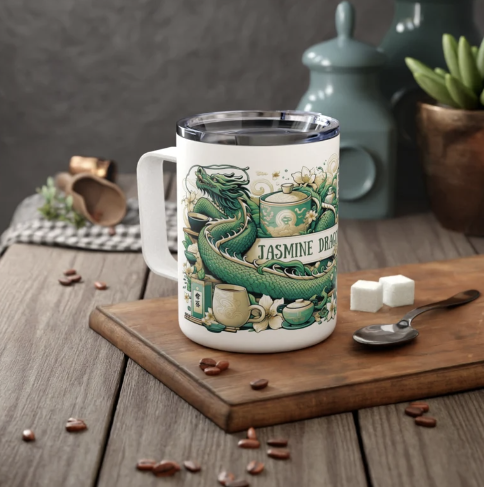 Mug with Jasmine Dragon design on cutting board surrounded by ingredients.