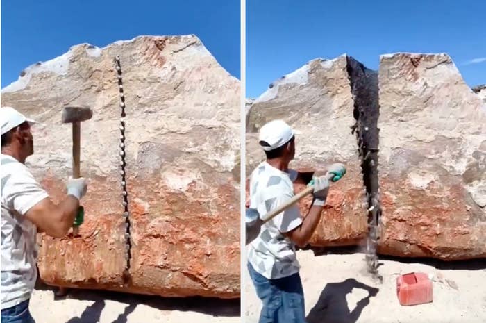 A person hammering a large granite stone in half vertically