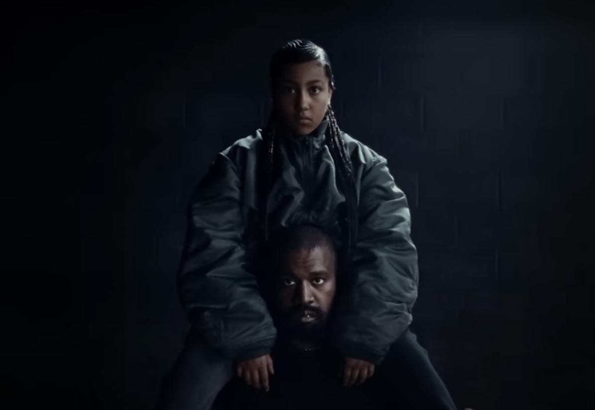 Close-up of Ye with North sitting on his shoulders