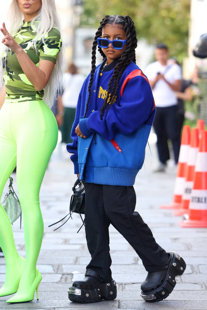 Close-up of North with Kim on the street