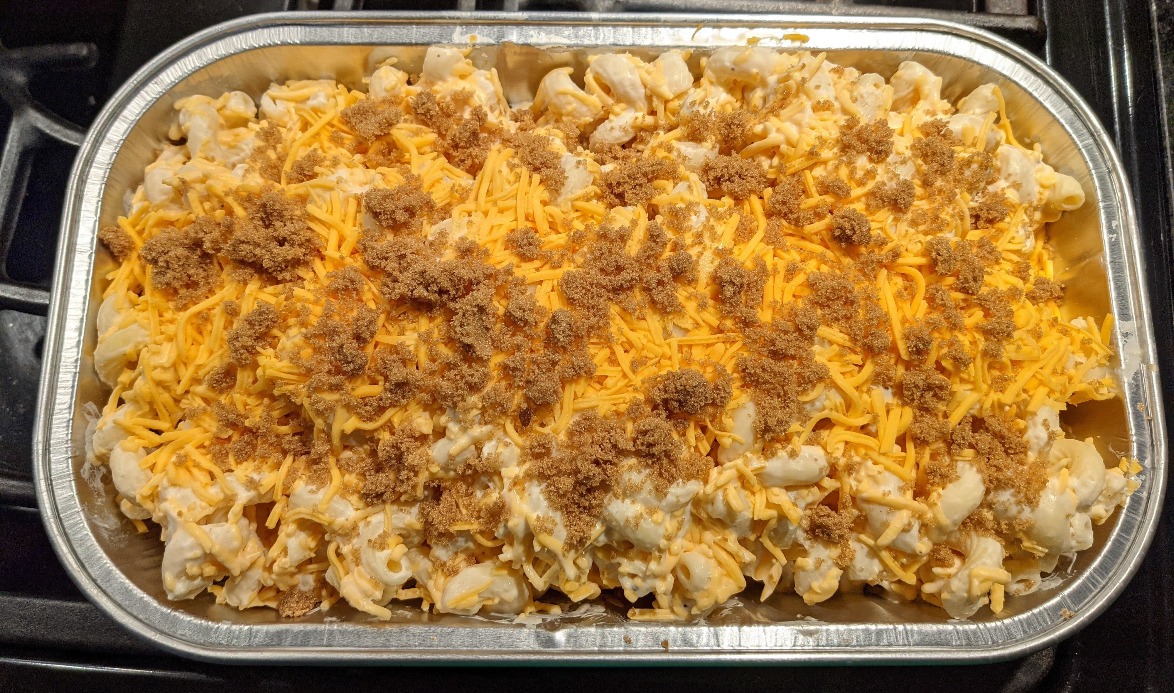 A tray of mac 'n' cheese sprinkled with brown sugar on top
