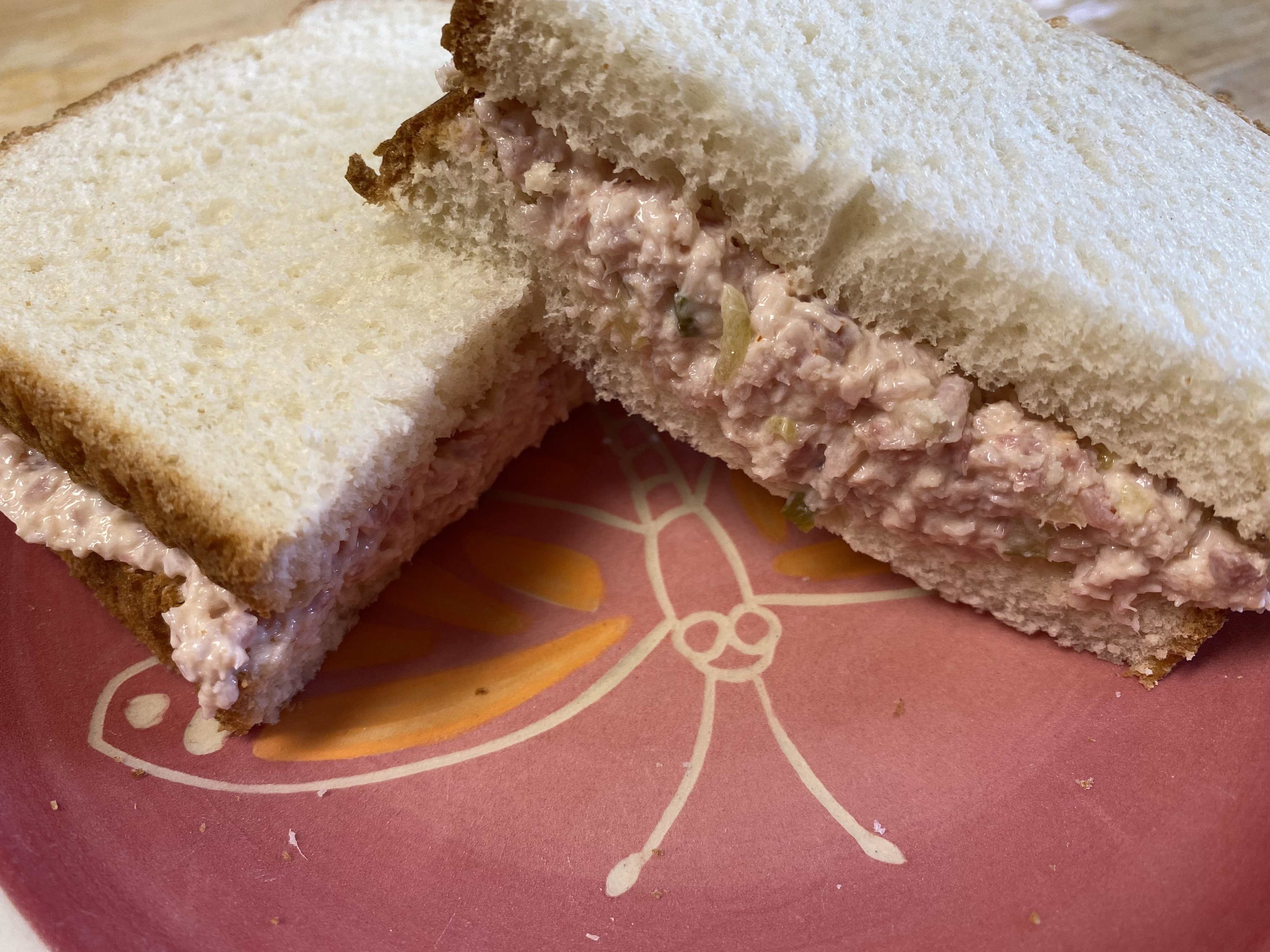 A ham salad sandwich on white bread