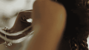 Woman braiding hair