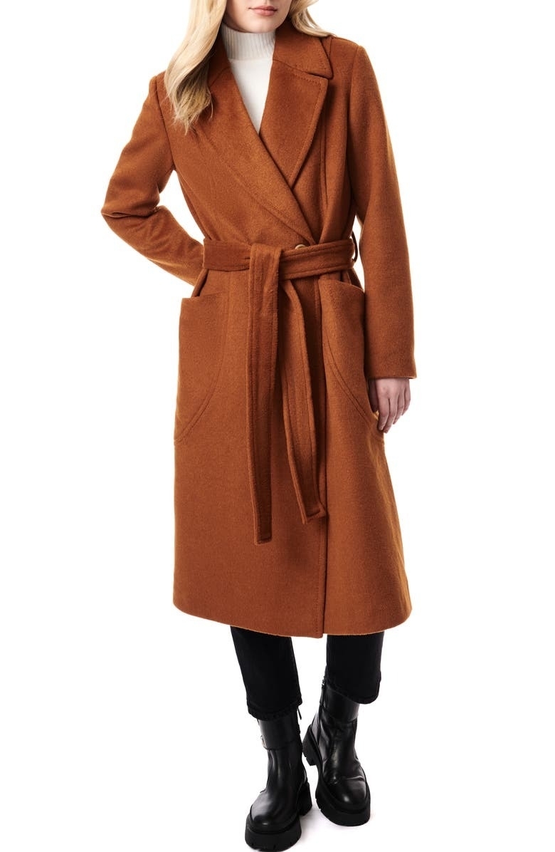 model wearing light brown belted longline coat