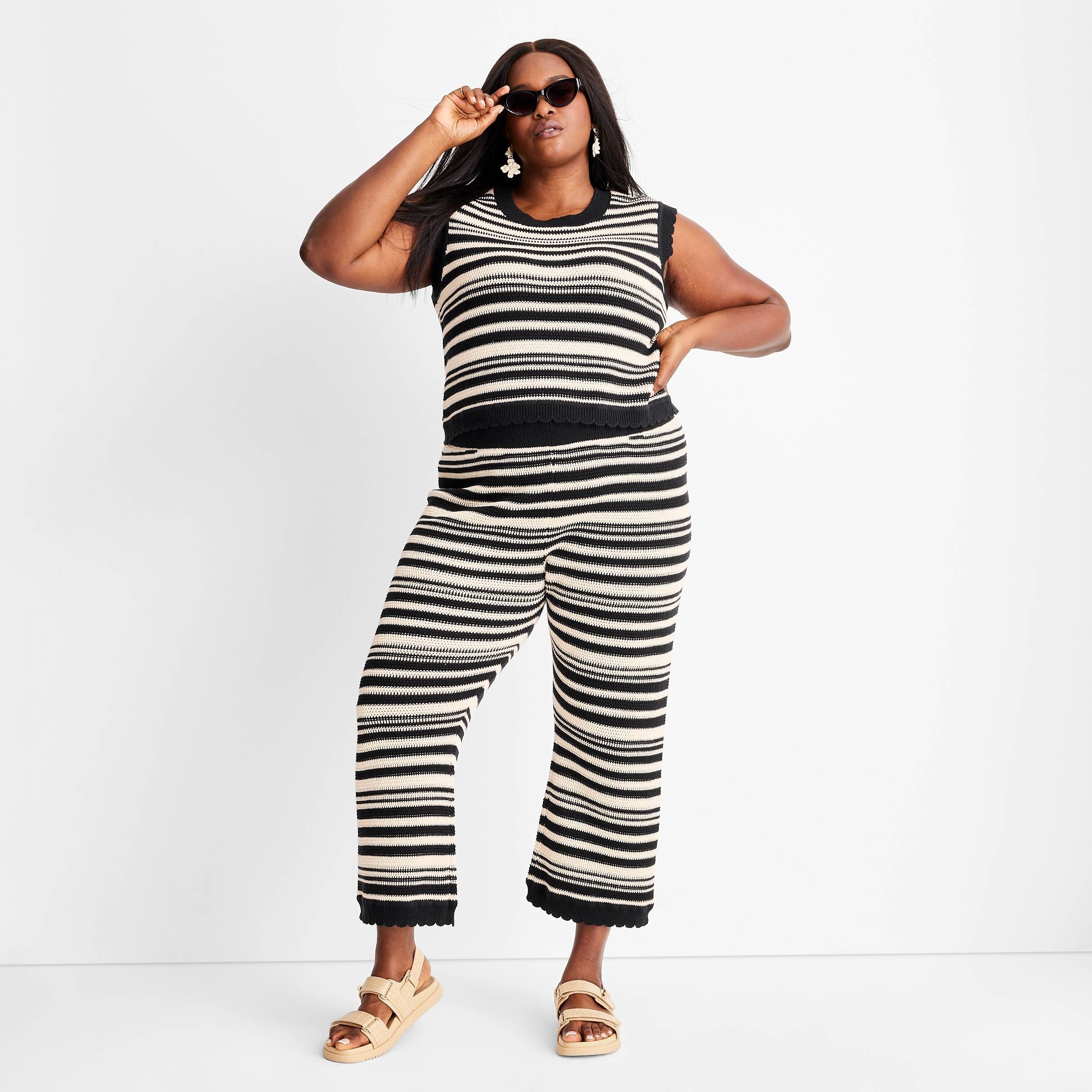 Model in black and white Cropped Stripe Sweater Pant Set by Jenny K. Lopez