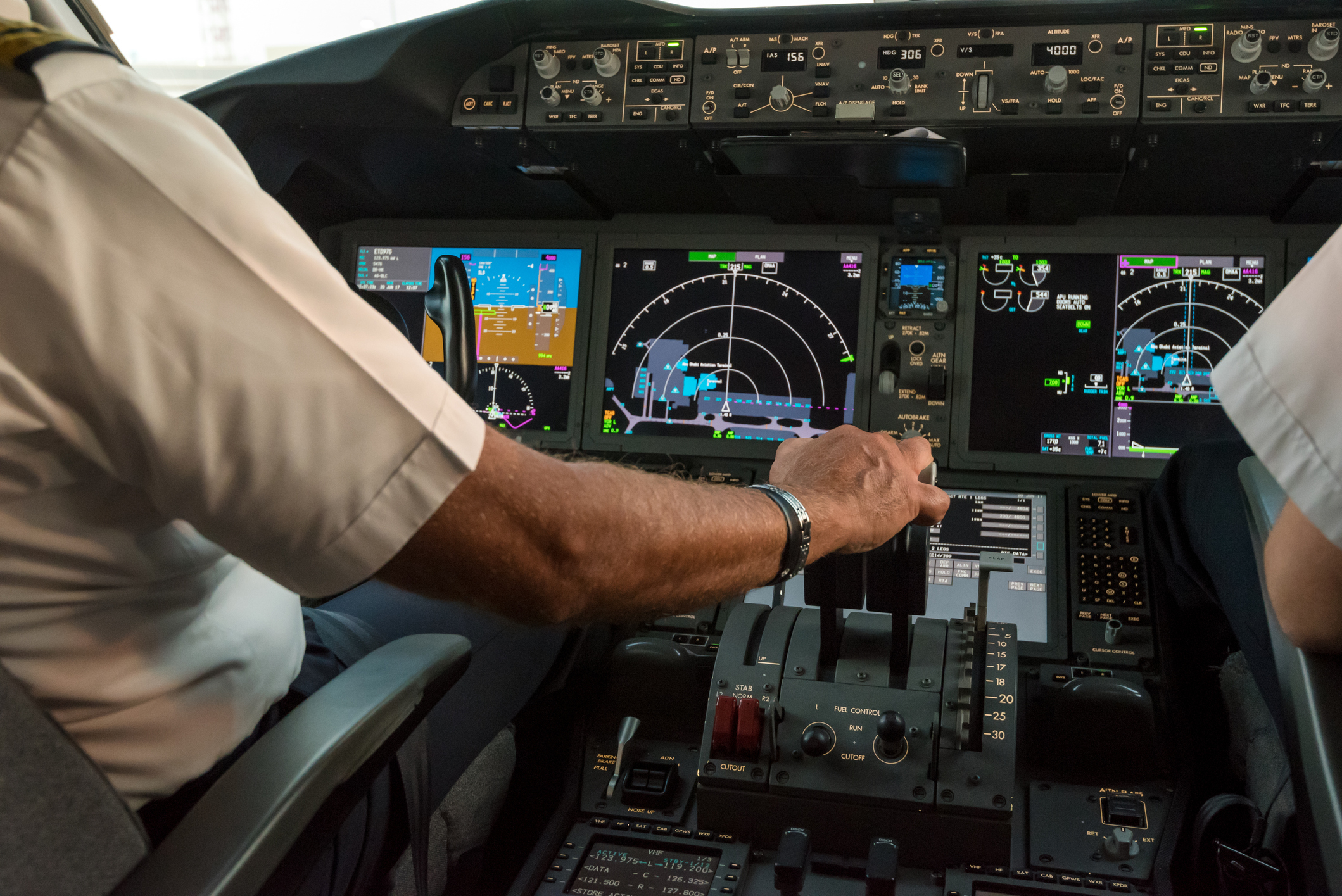 pilot moving controls on a plane