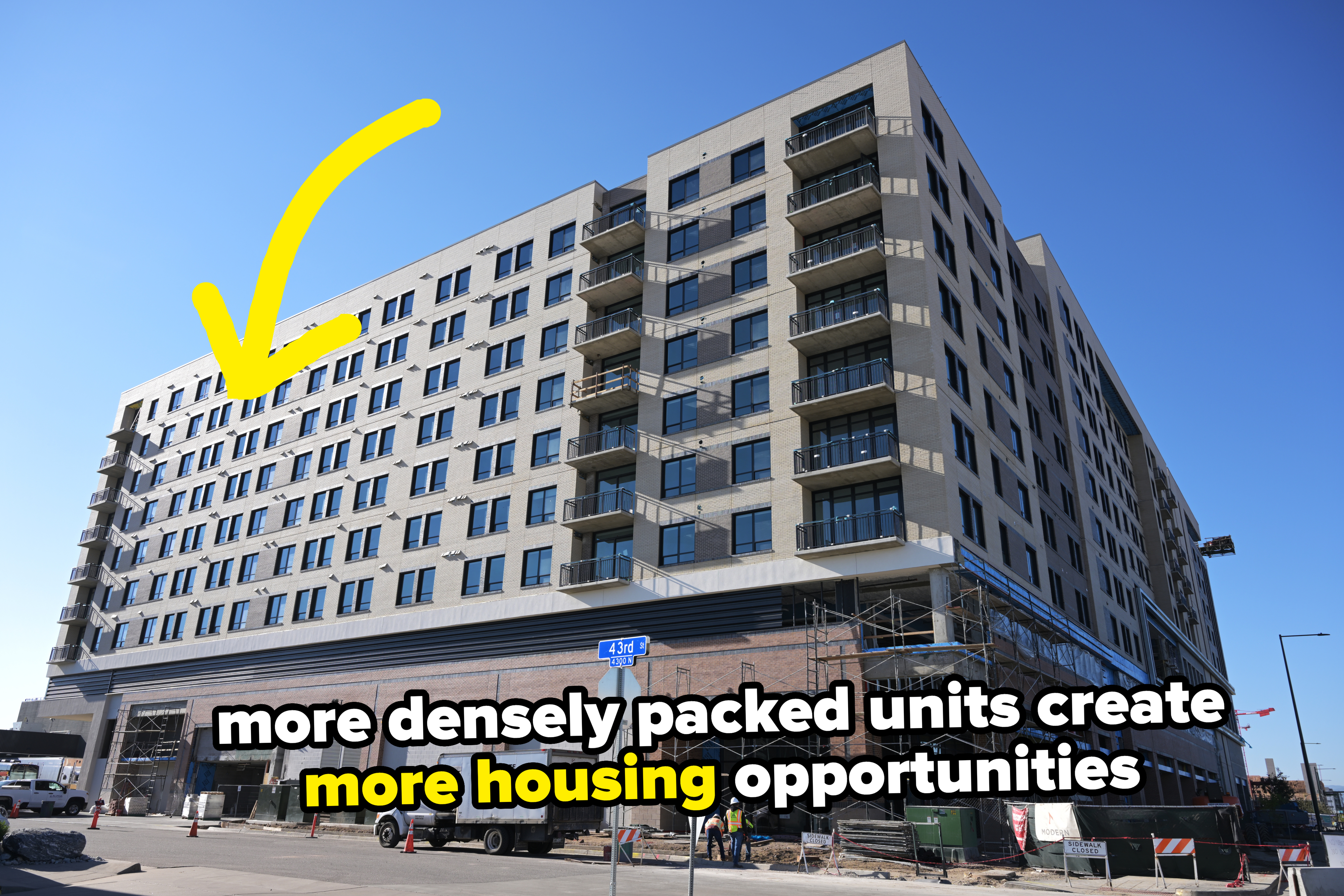 New apartment building with caption that says &quot;more densely packed units create more housing opportunities&quot;