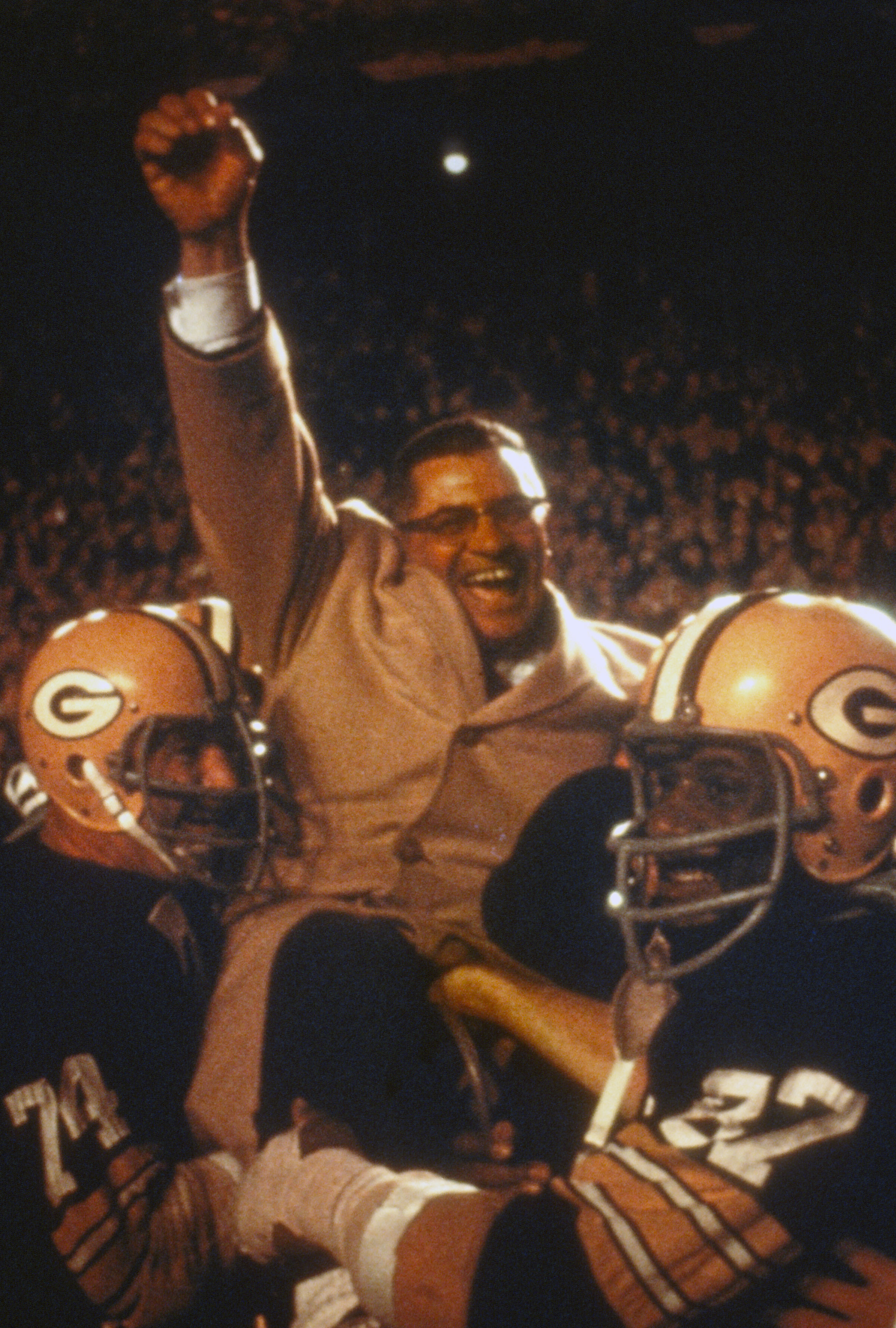 The Green Bay Packers holding up Vince Lombardi