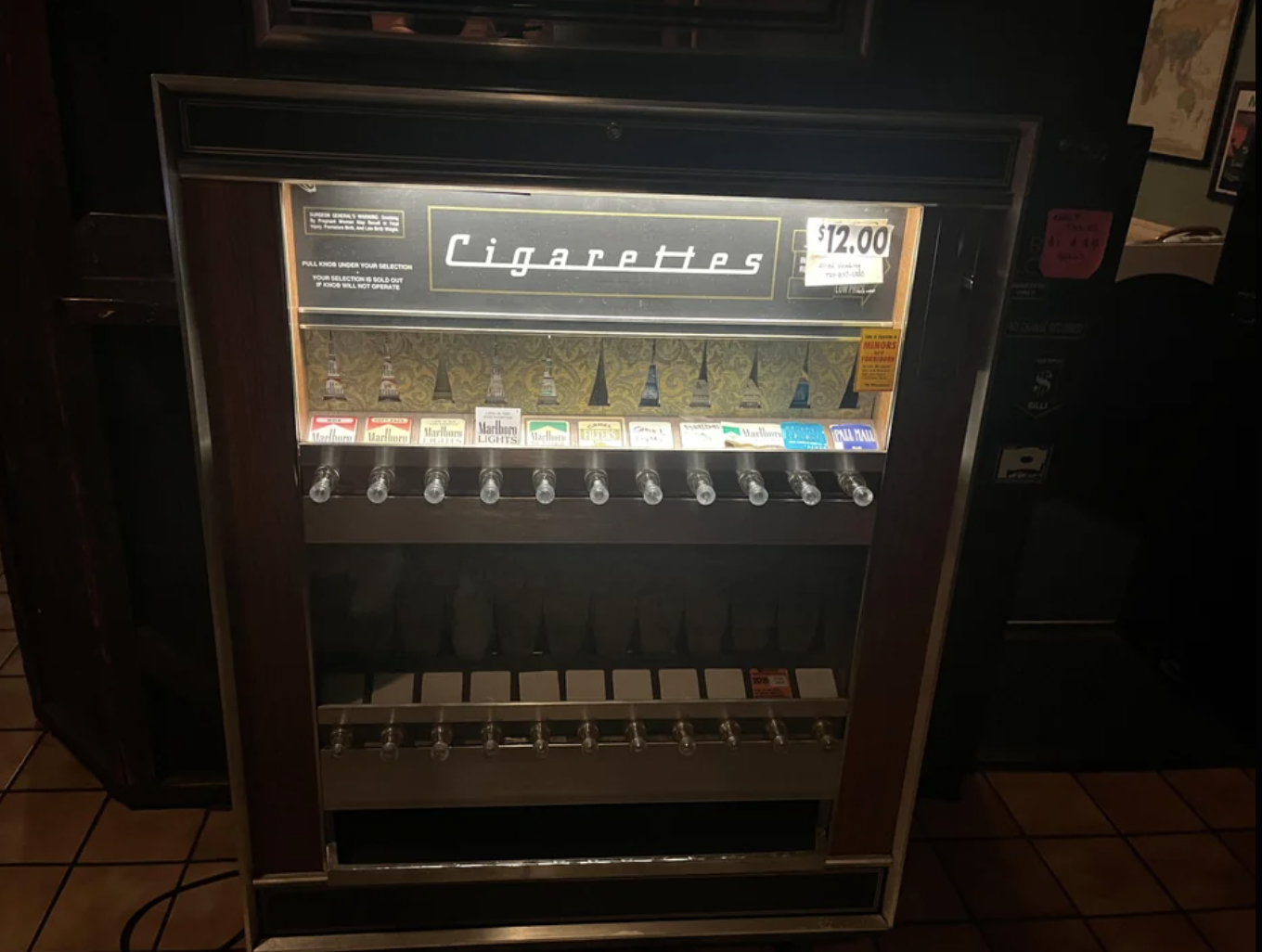 A cigarette vending machine is shown