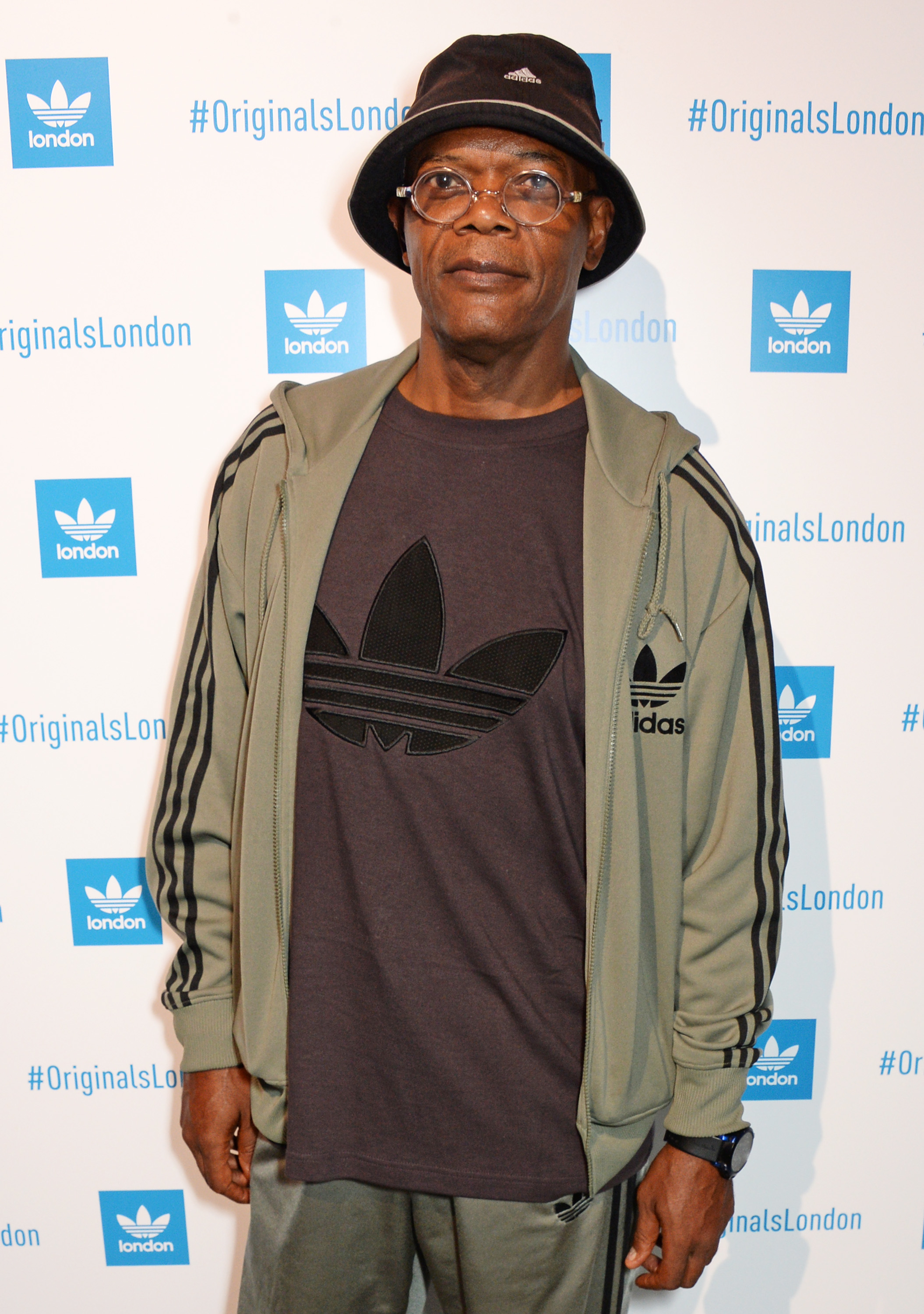 he&#x27;s wearing glasses and an adidas outfit for an event