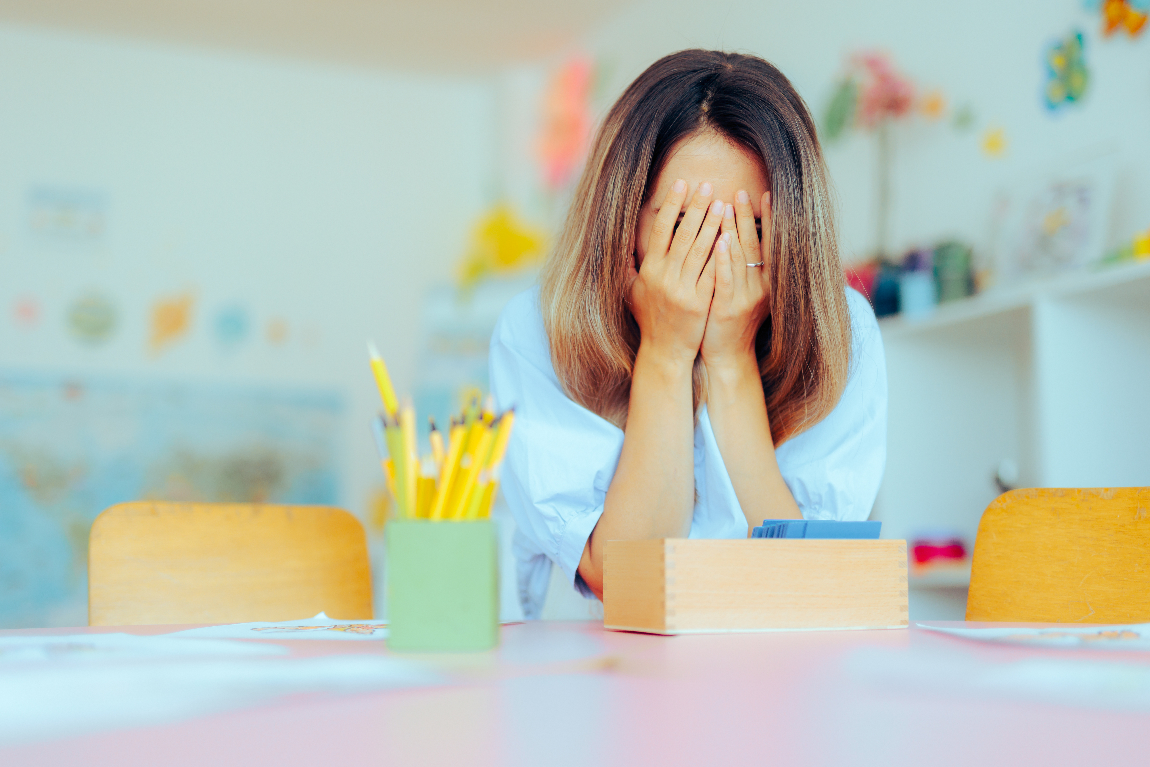 stressed teacher in her classroom