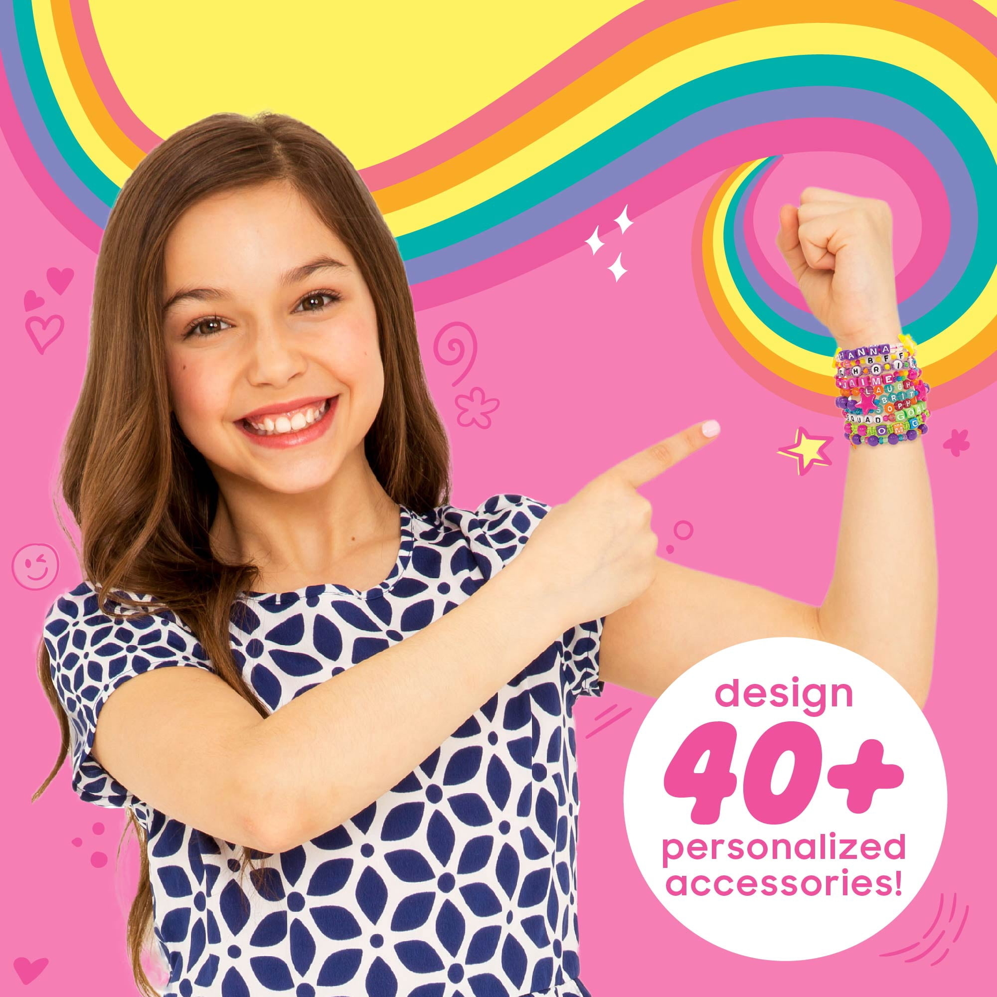 girl pointing to multicolor bracelets made with the kit
