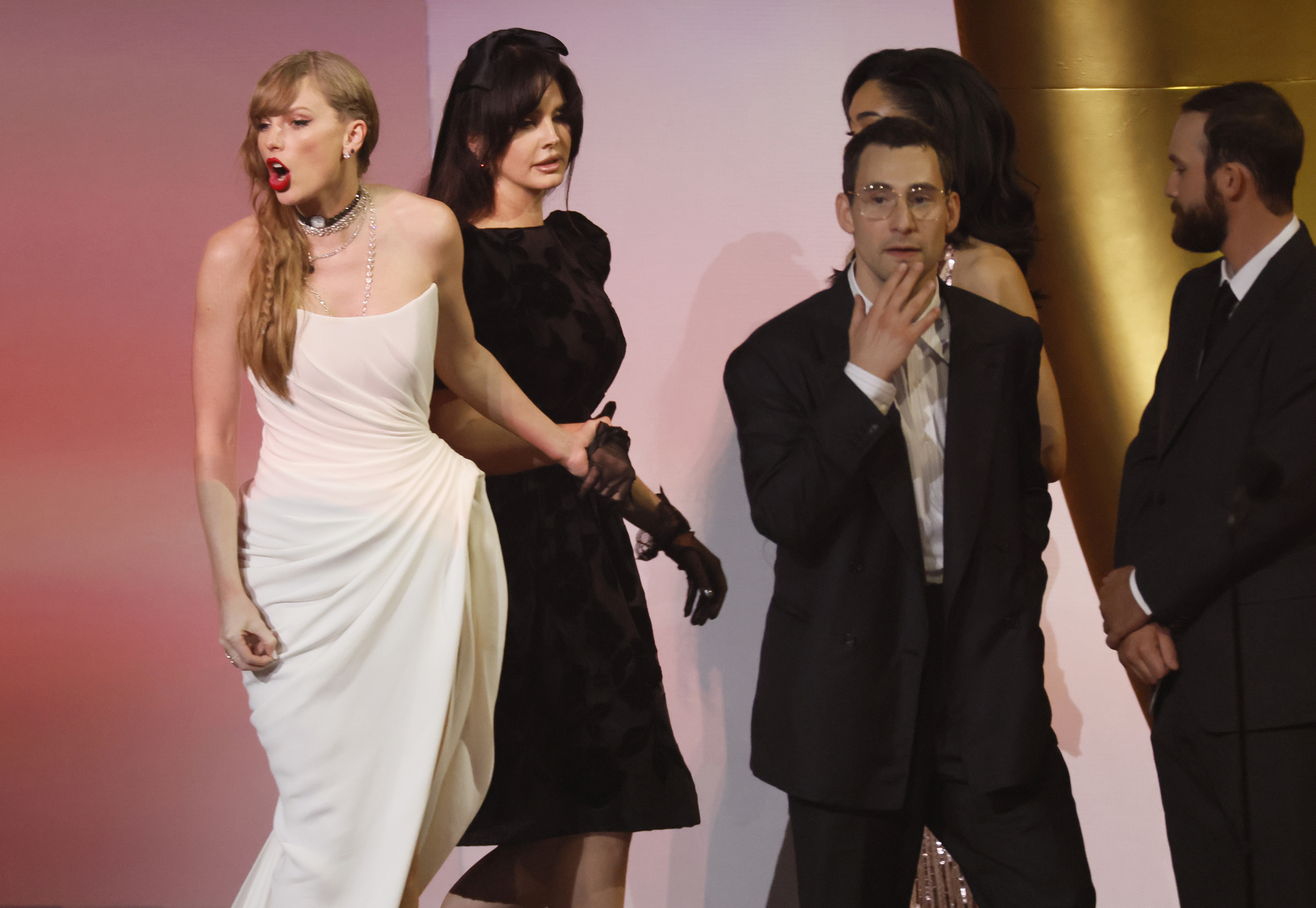 Close-up of Taylor onstage with Lana and others