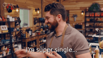 A man walking through a coffee shop saying, &quot;I&#x27;m super single...SUPER SINGLE.&quot;