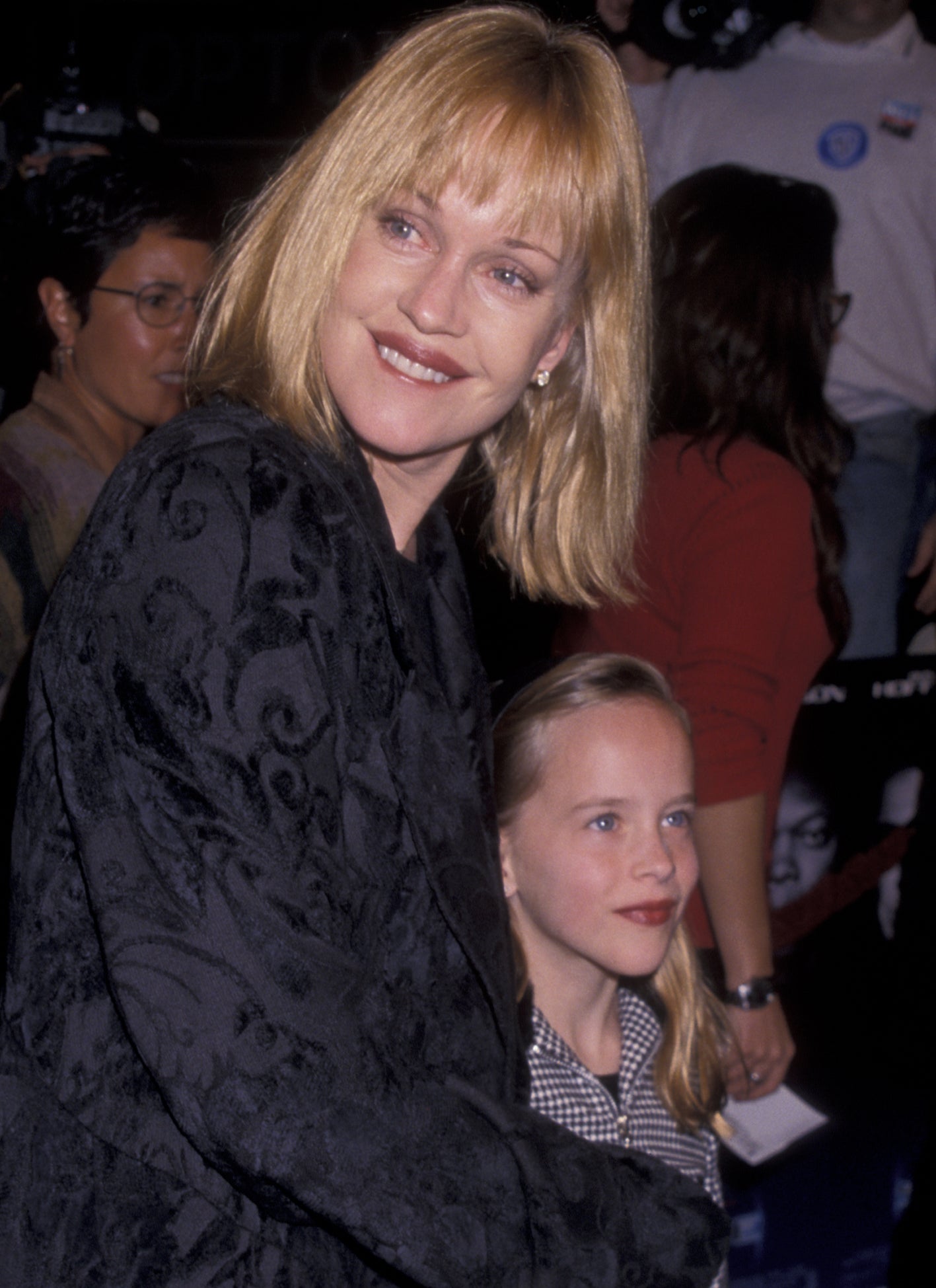 Close-up of Dakota as a child with Melanie Griffith at a media event