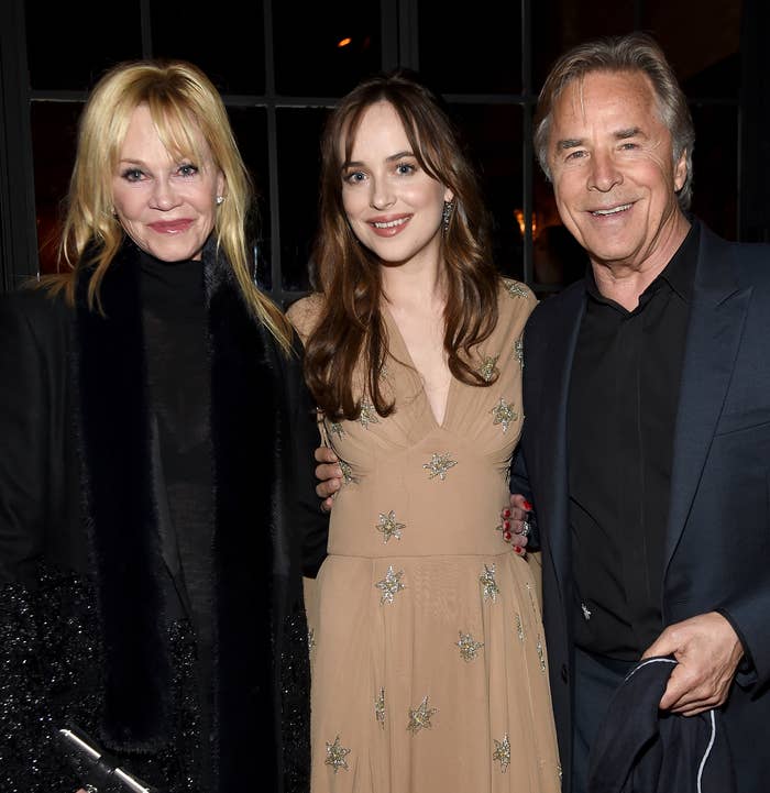 Close-up of Dakota with Don and Melanie at a media event