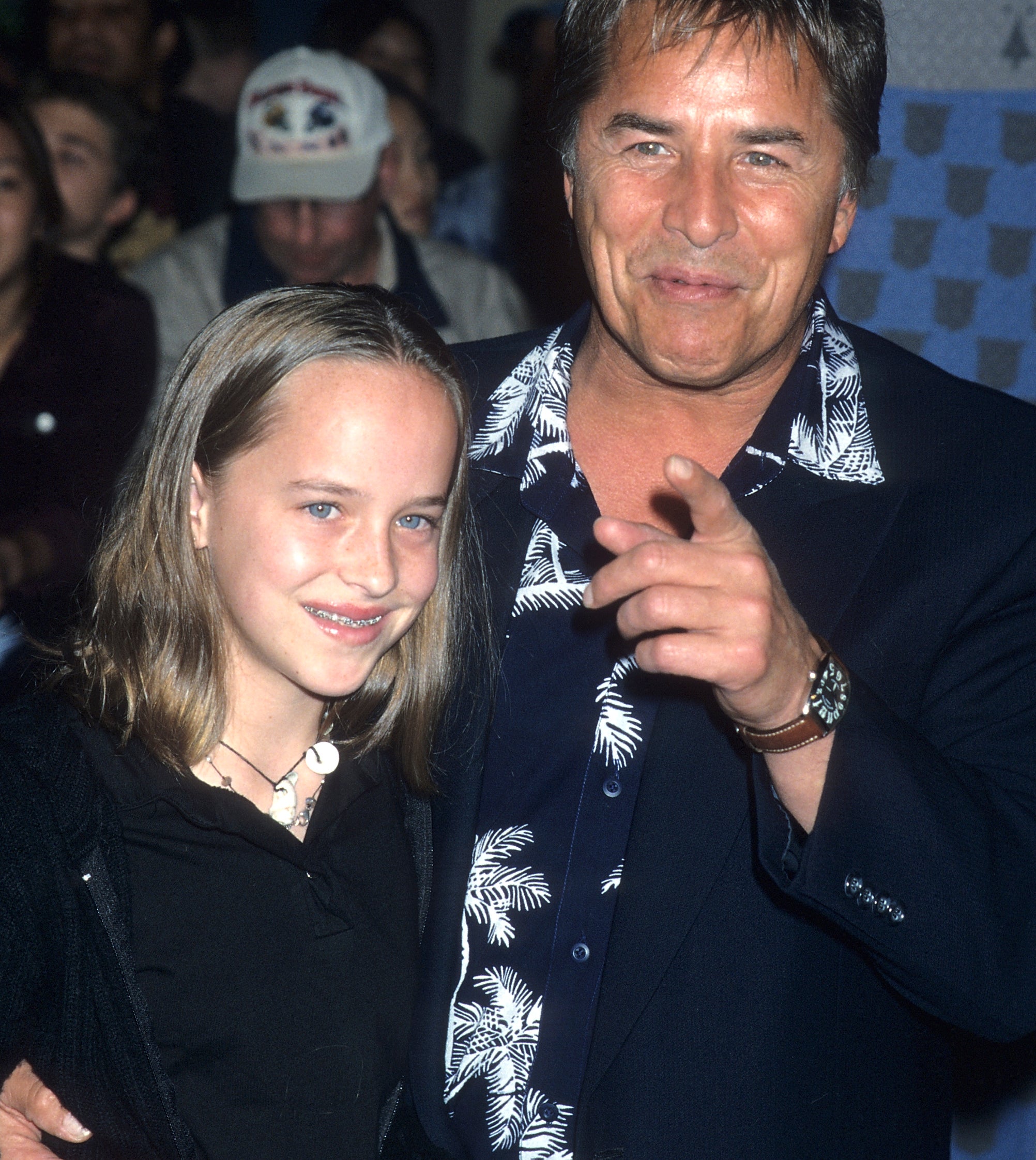 Close-up of Dakota as a child with Don Johnson at a media event