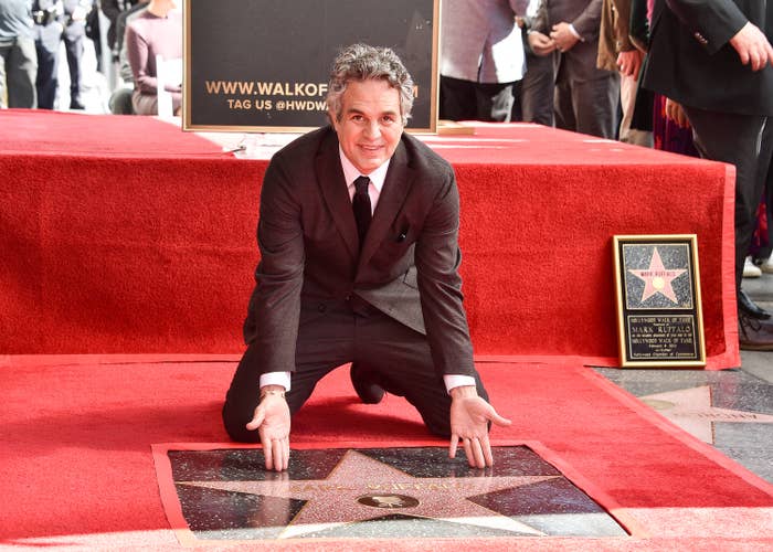Close-up of Mark kneeling at the Walk of Fame ceremony