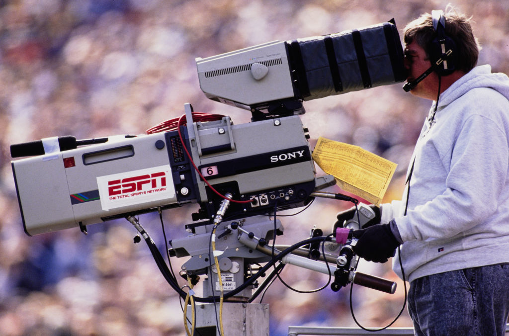 A broadcaster with a ESPN video camera