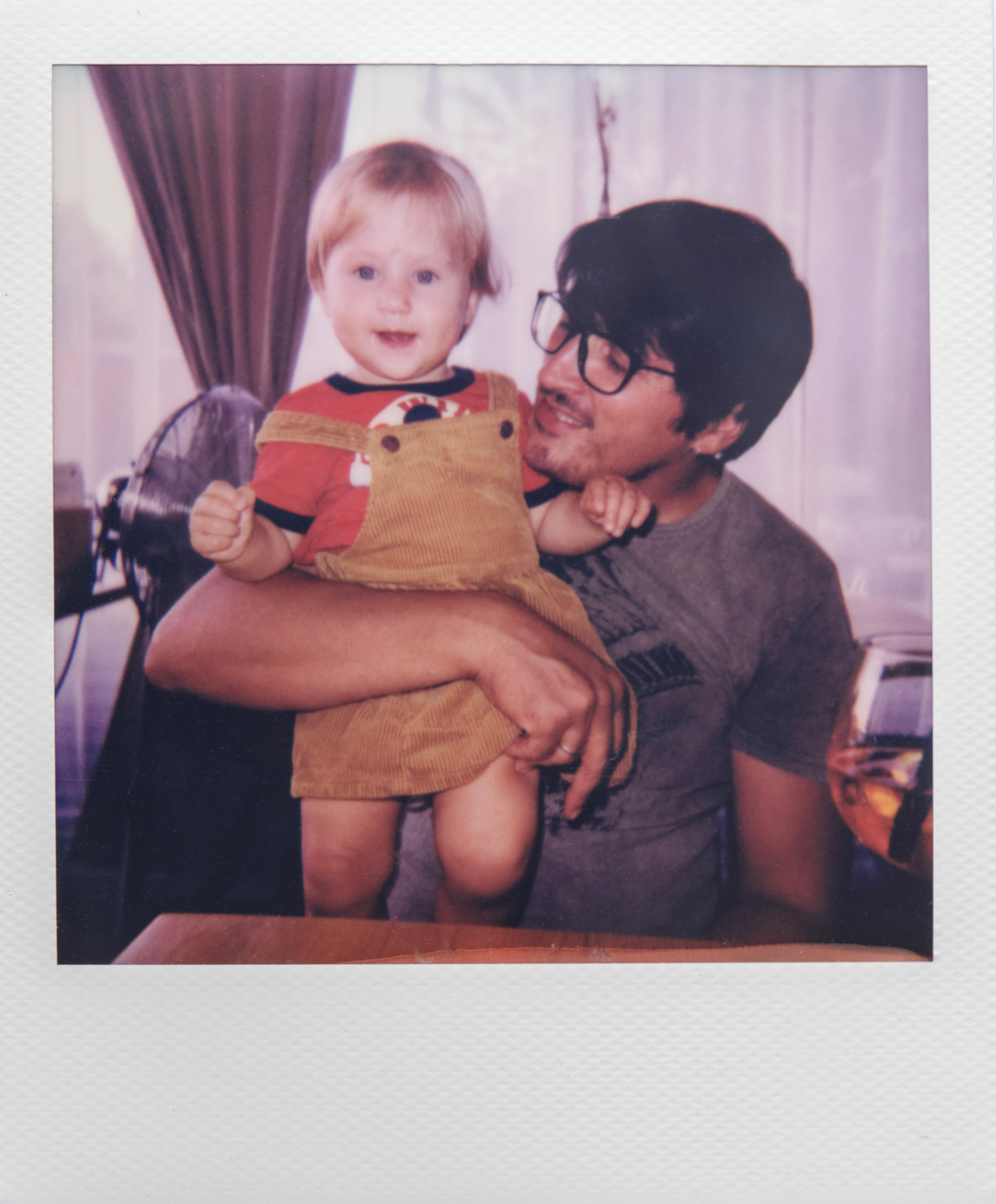 polaroid of a son and dad