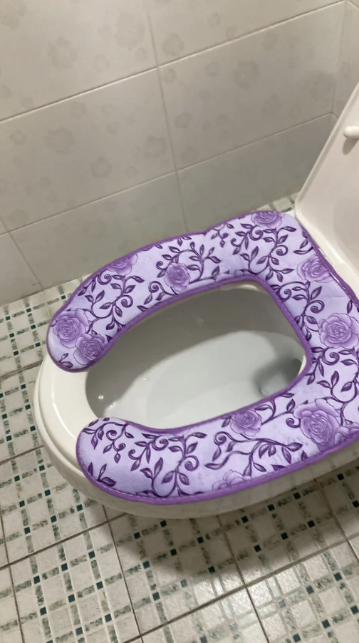 A floral fabric toilet seat cover