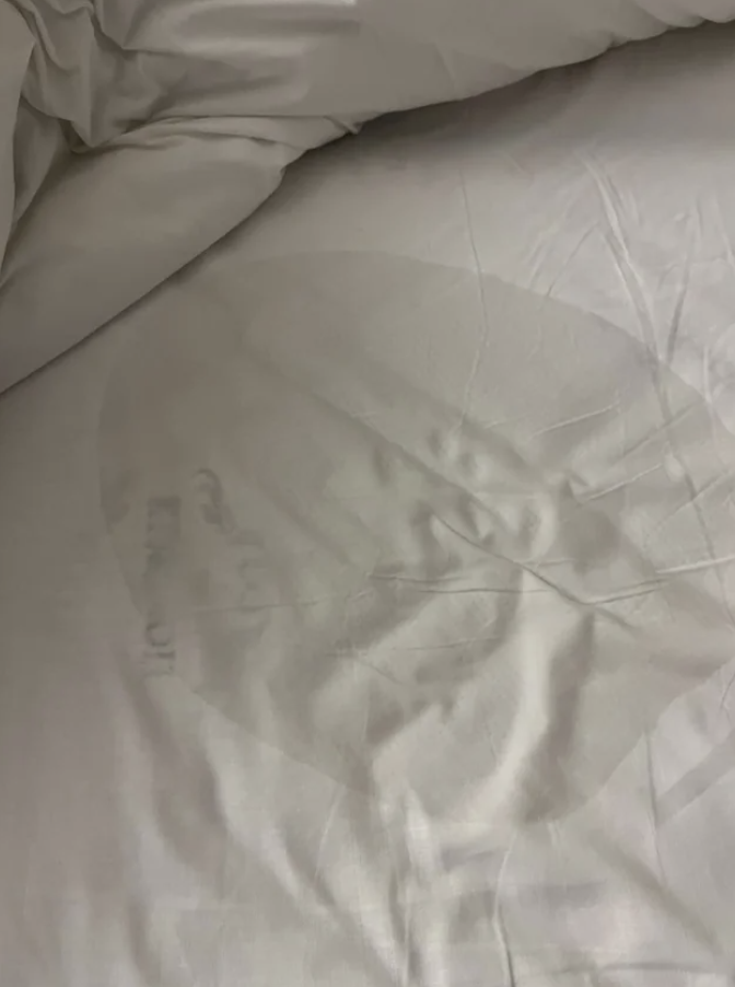 A huge wet spot on a sheet