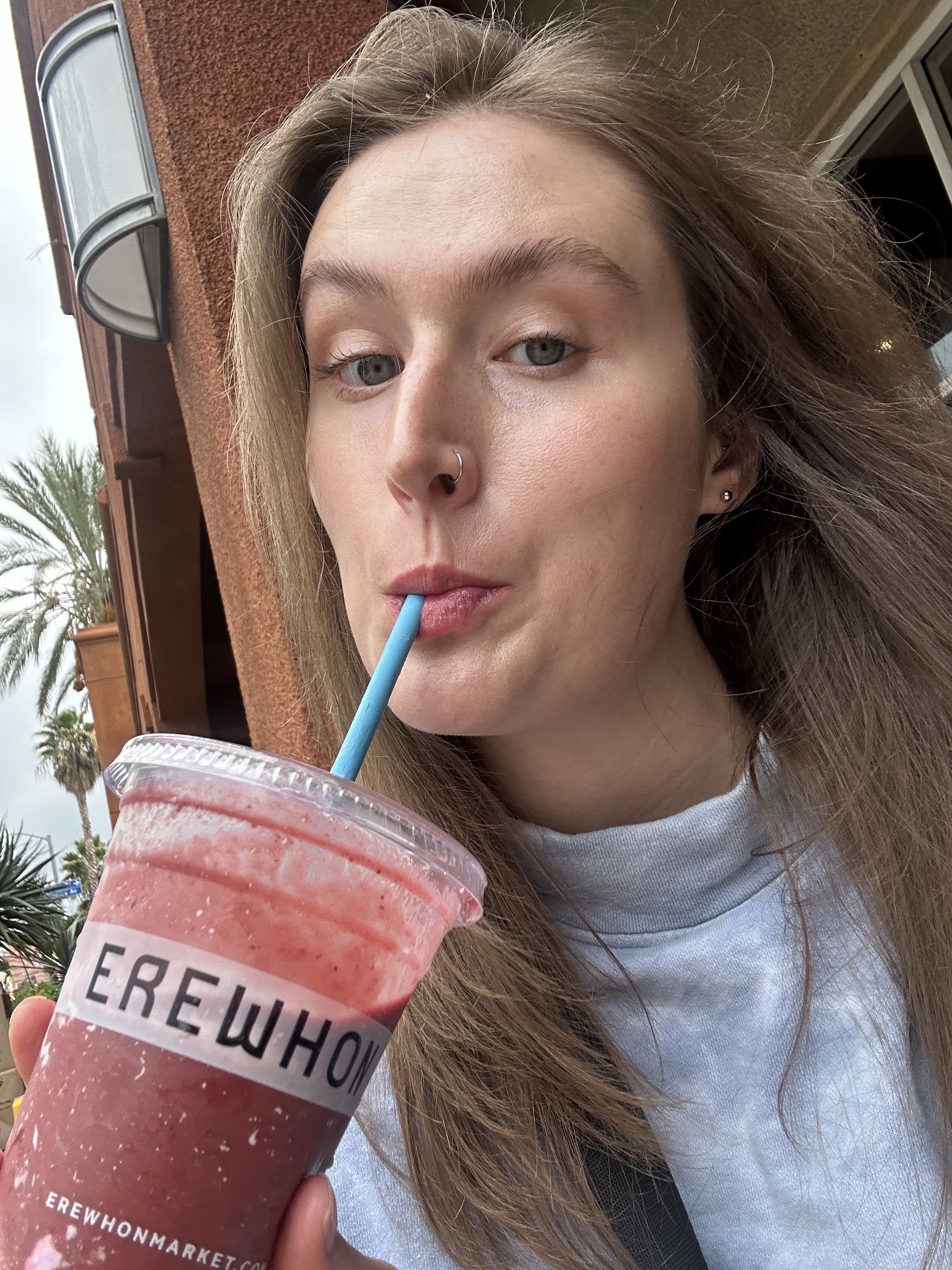 author sipping the smoothie