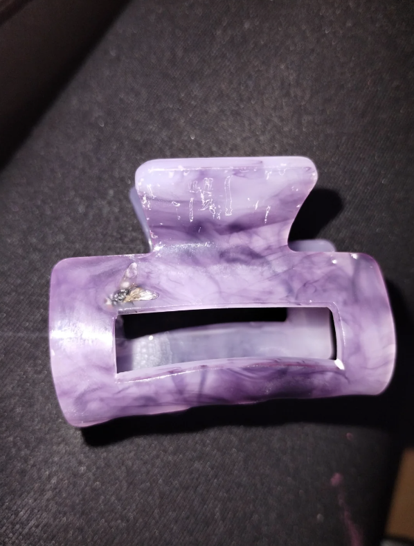 hair clip with a fly inside the glaze coating