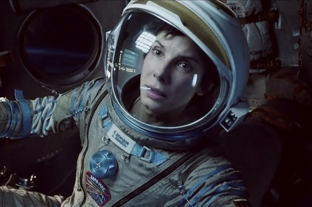 Sandra Bullock wearing a space suit as Dr. Ryan Stone in a spacecraft from the movie &#x27;Gravity&#x27;