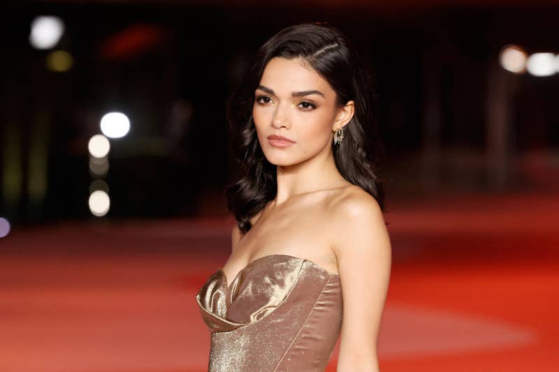 Rachel Zegler in elegant strapless gown posing on the red carpet
